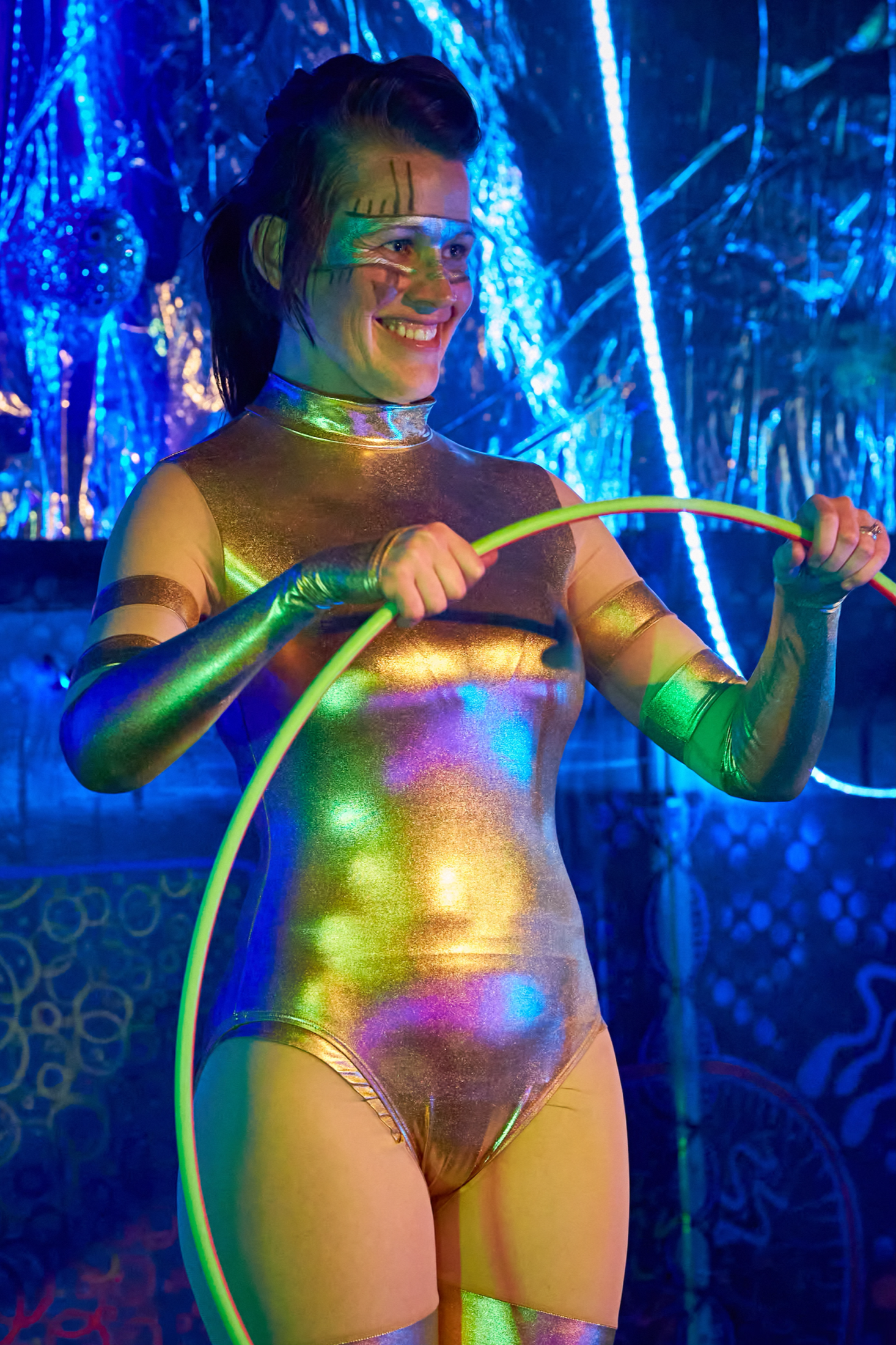 Kayley Quick smiling onstage with a hoop during the 2015 Robot Apocalypse