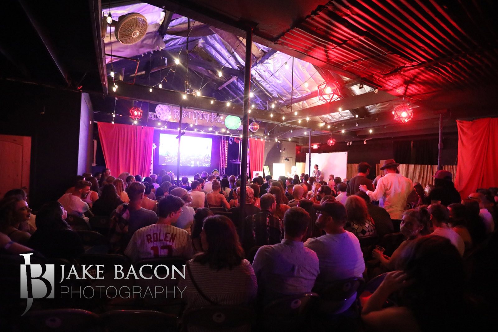 Packed Yucca North audience watching the illuminated Robot Apocalypse stage