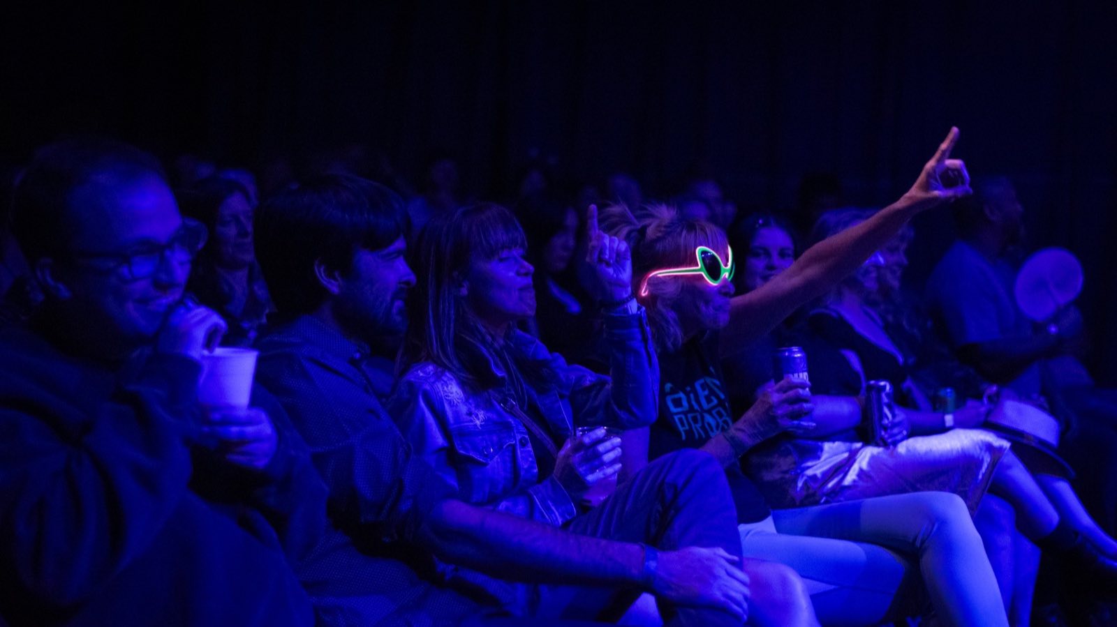 Worlds and Wastelands audience gathered under blue stage light