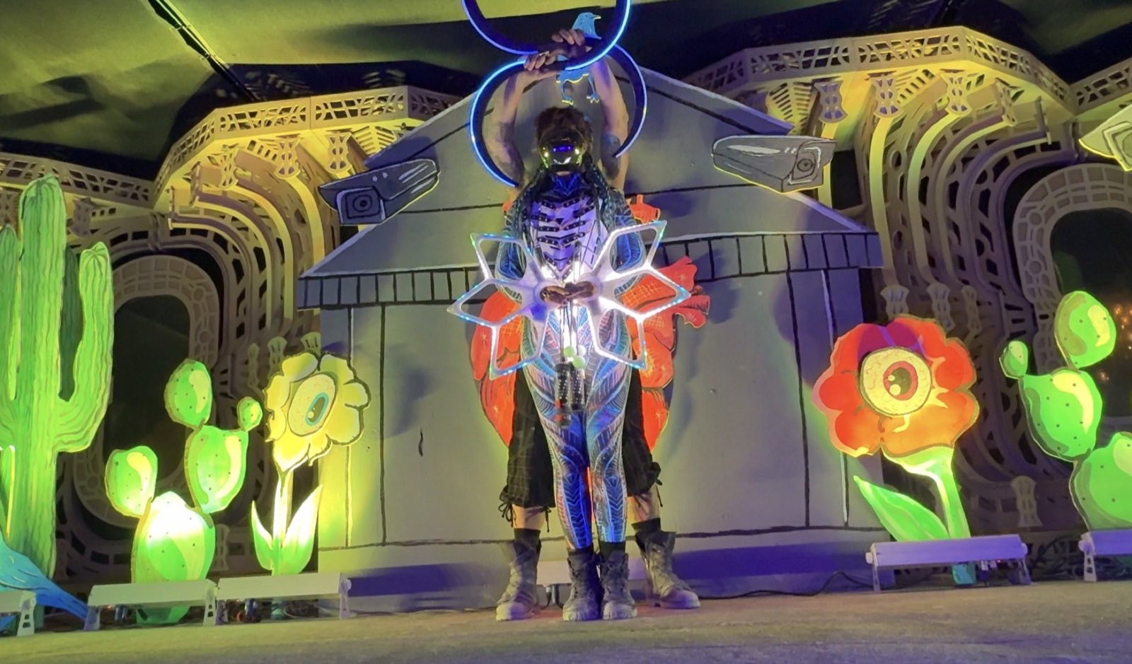 Two Hearts and Hardware performers combining illuminated flower and hoop props