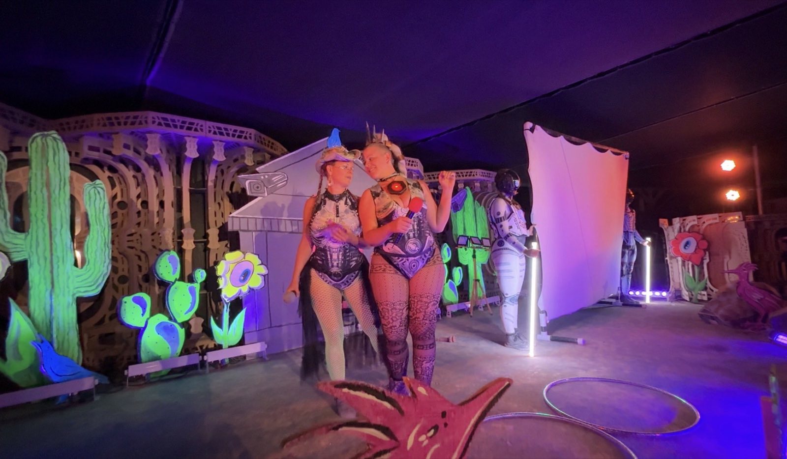 The Queen of the Robots sharing a moment with another performer onstage