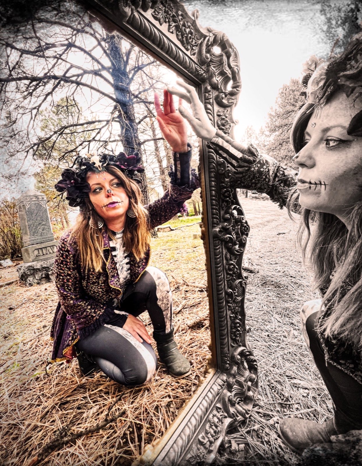 Carlie Nannini in theatrical makeup posing with an ornate mirror outdoors